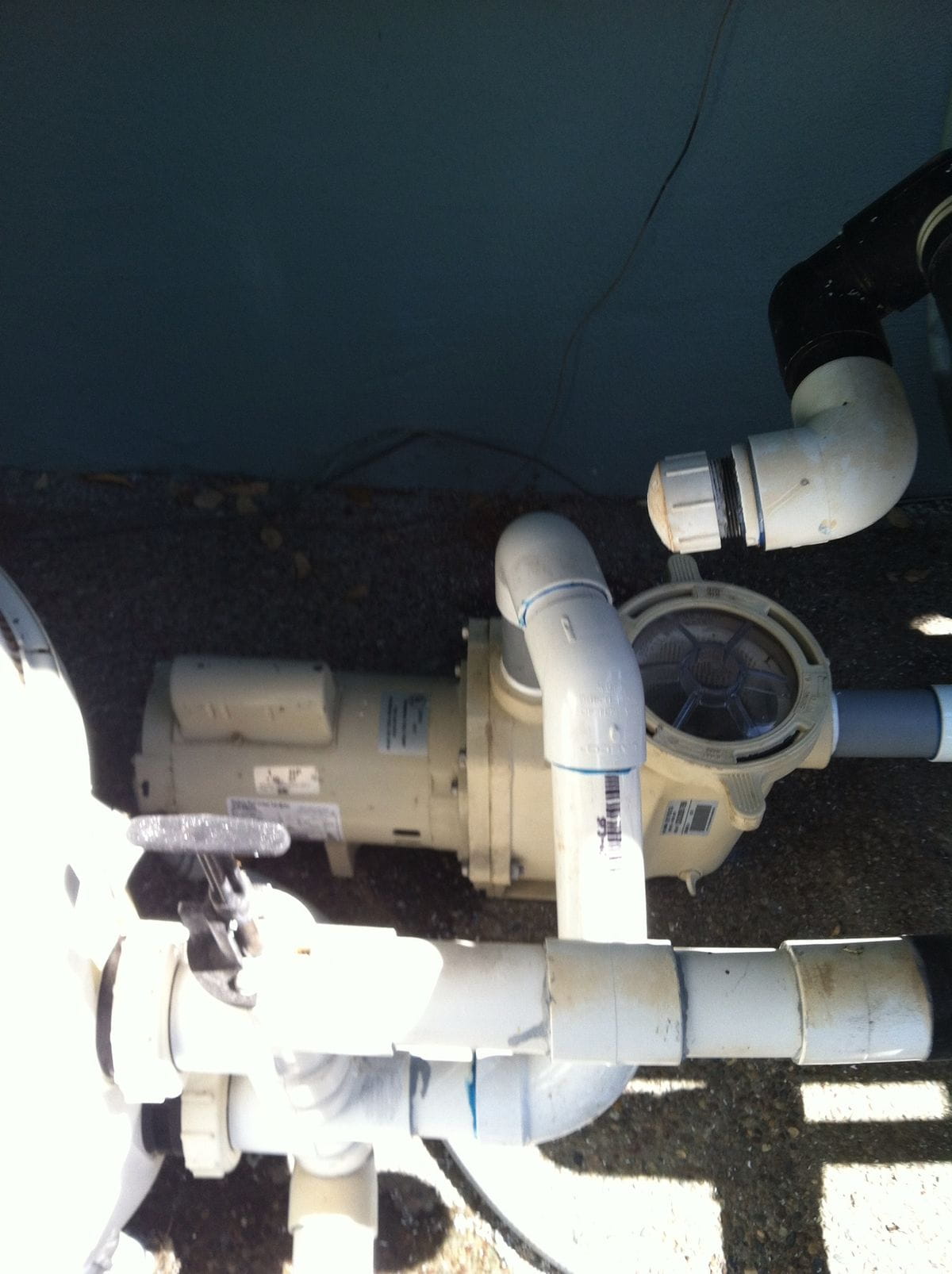 Buff Pools technician repairing residential swimming pool equipment